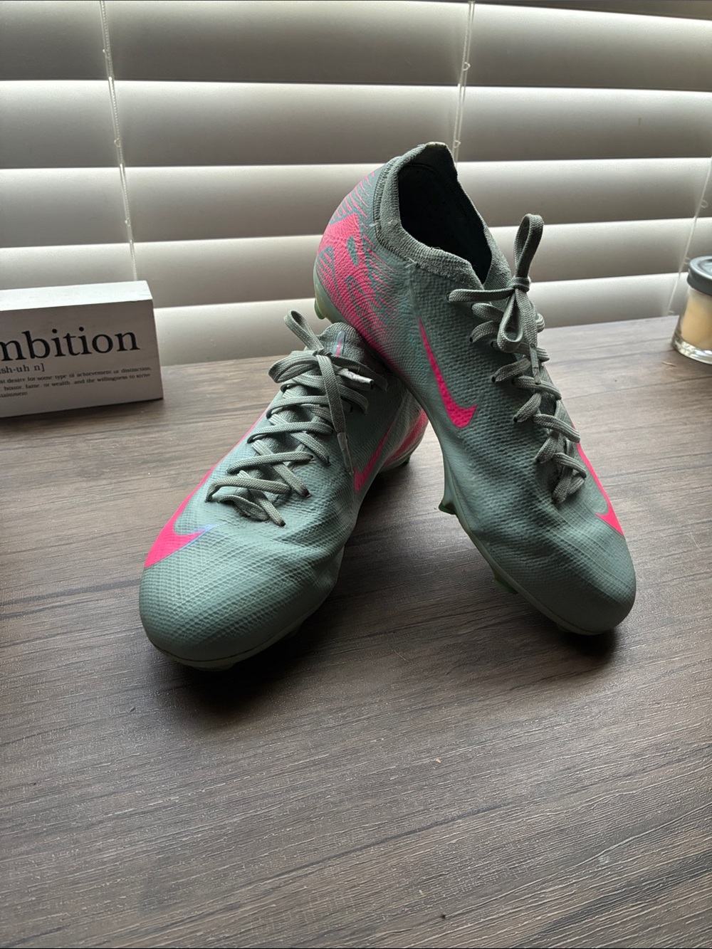 Nike Big Kid’s Mint Green Soccer Cleats with Pink Swoosh Accents